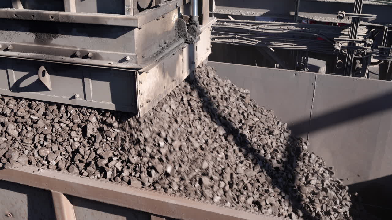 A Rapid Loading System loads manganese ore into a rail wagon on a mine