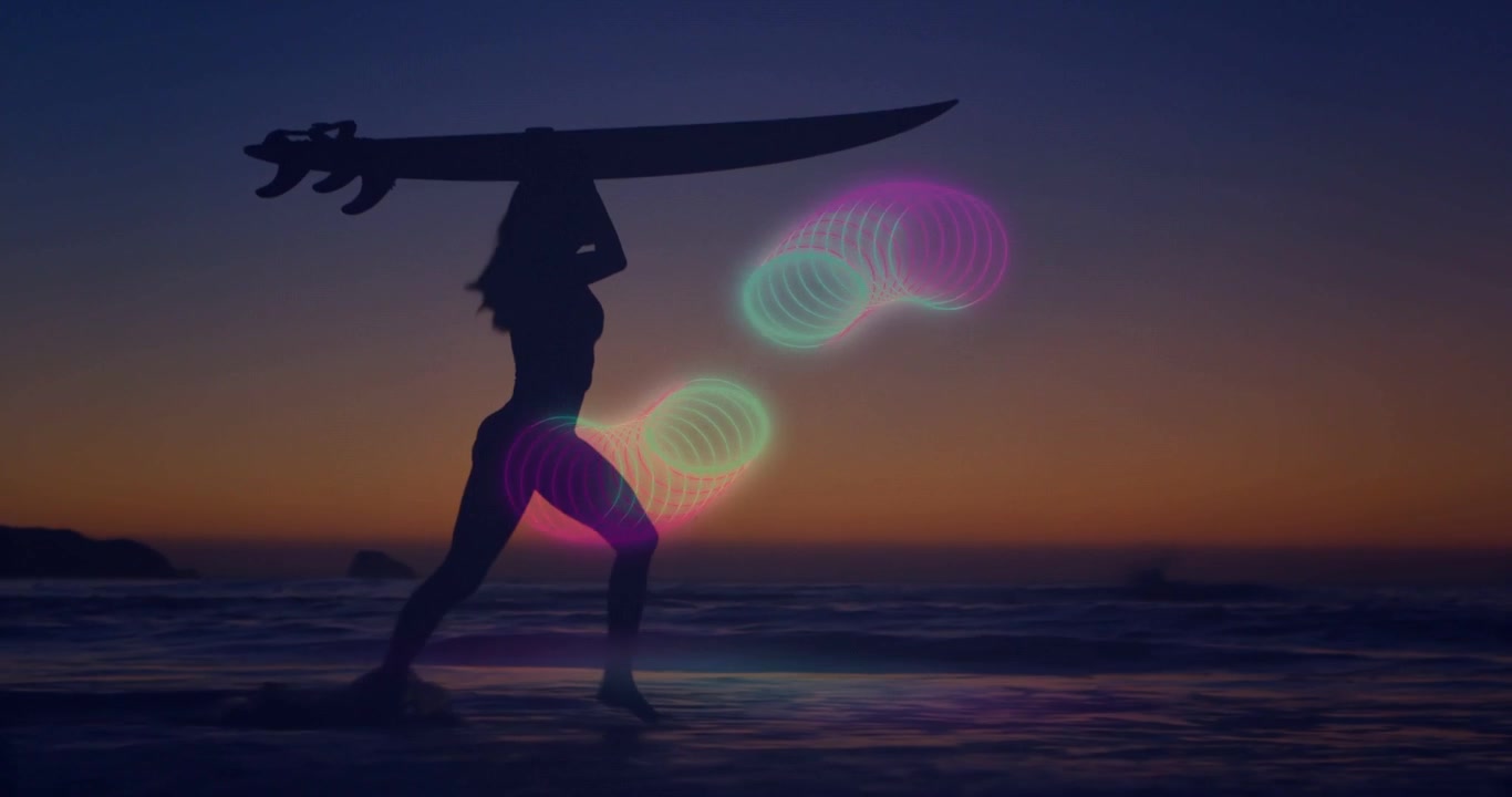 Vertical video: Surfer walking toward sea with board, steps making neon orbs into ribbon for tech