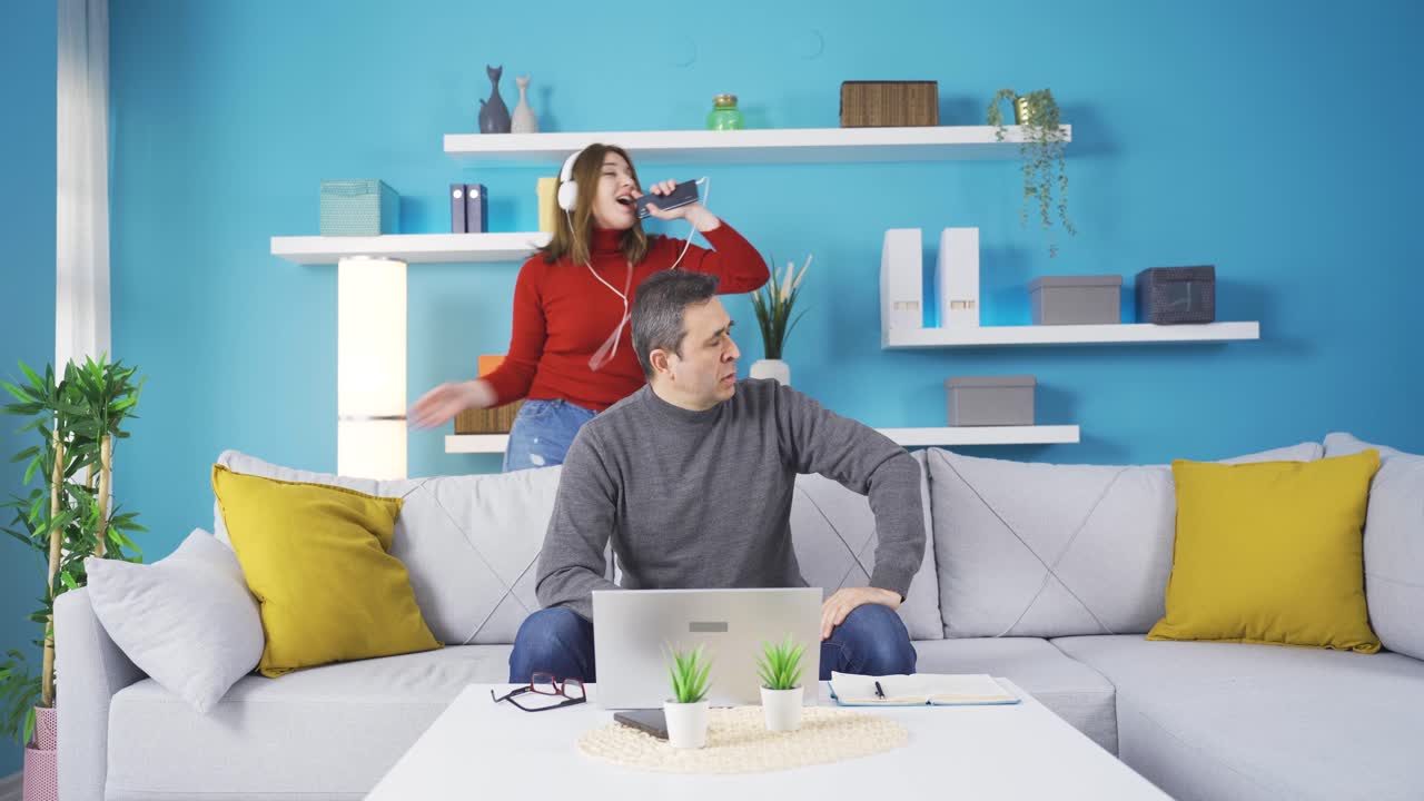 The girl who disturbs her father by singing and dancing.