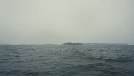 sailing towards an island during storm slow motion