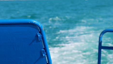 blue boat back view