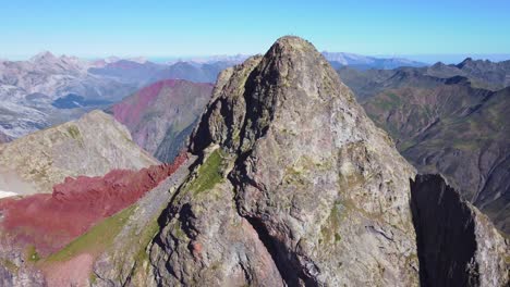 Aerial-view-of-Anayet-mountain-range-peak-and-lake-in-Spanish-and-french-Pyrenees-in-Summer-morning