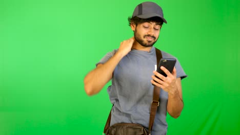 indian-tourist-try-to-find-the-way-on-road-with-green-background---green-screen