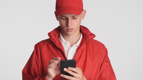 courier boy chatting with smartphone