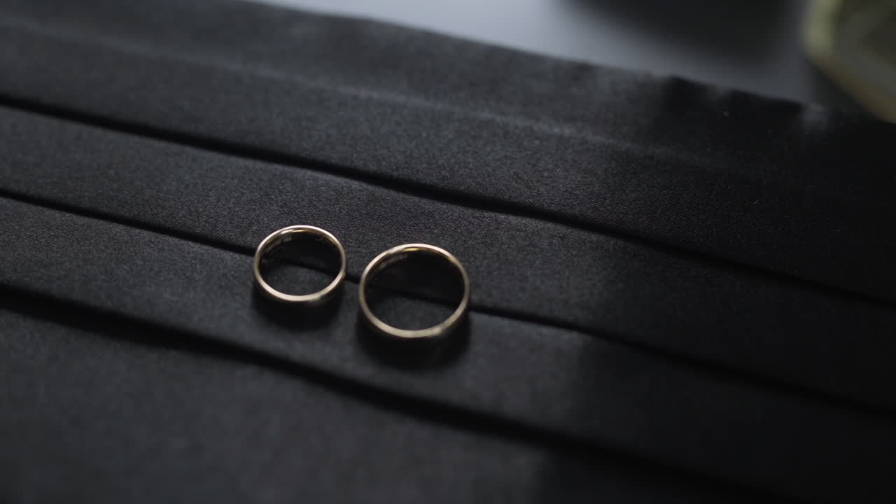 Wedding Rings on Black Fabric