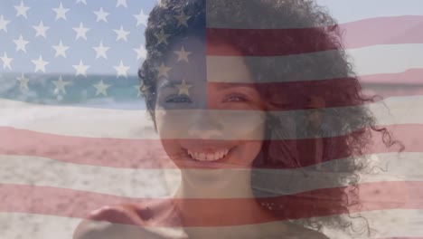animation of biracial man by sea over flag of usa