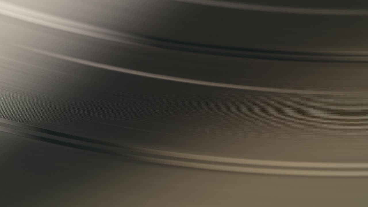 Abstract Close-up of Spinning Vinyl Record Grooves