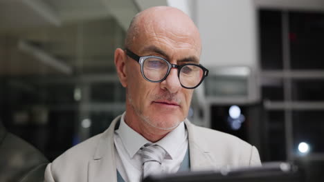 man in suit wearing glasses