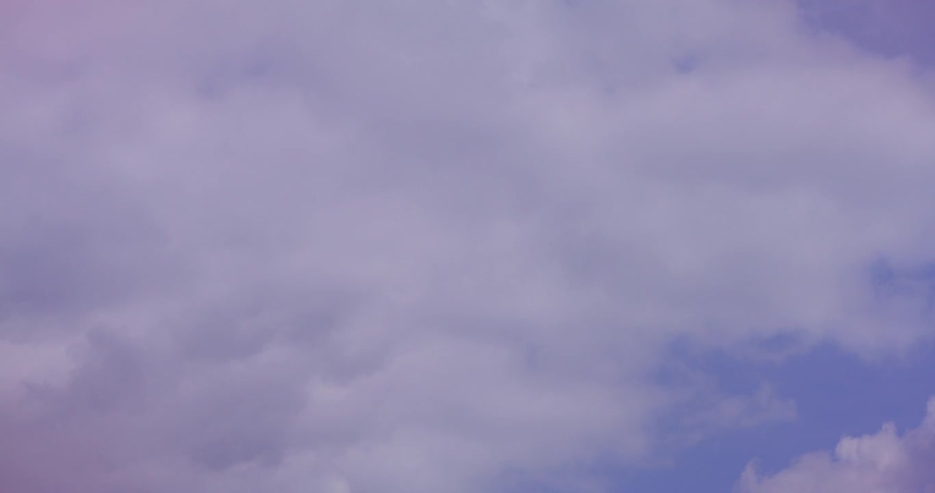 Moving Clouds in a Purple and Grey Sky