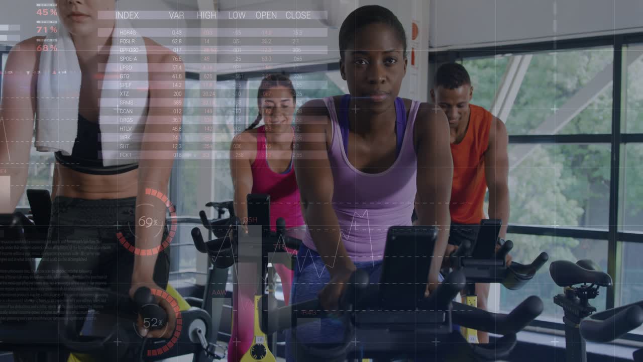 Central woman pedaling spin bike via console, fitness graphs overlaying riders tracking cadence