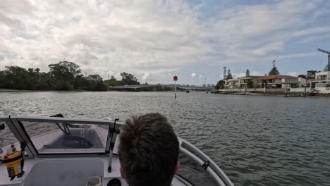 a scenic boat journey towards a vibrant waterfront