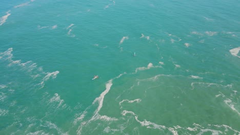 aerial view of fishing boat in the middle of a wavy sea - 4k drone shot