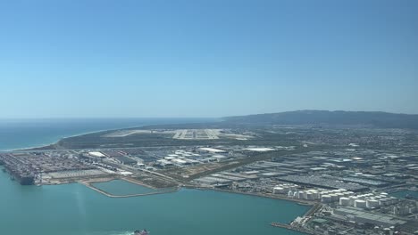 pov aerial view of barcelona airport, spain, shot from a jet approaching to the airport