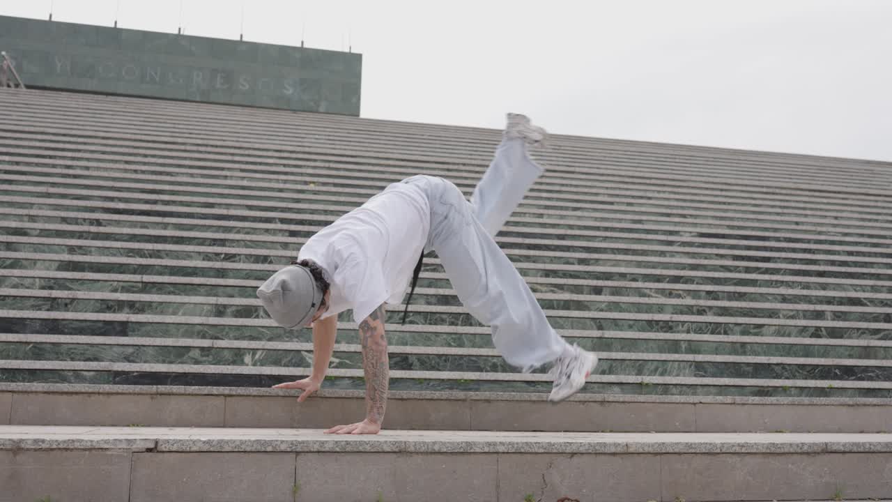 Breakdancer performing on urban stairs