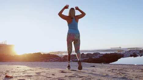 disabled woman exercising in the beach at dusk 4k