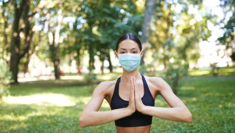 woman practicing yoga outdoors during pandemic