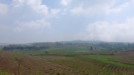 paddy-fields-with-mountain-and-bright-cloudy-sky-at-evening-at-day-video-is-taken-at-meghalaya-north-east-india