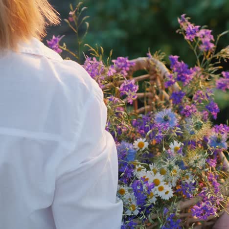 Woman-carries-a-basket-with-wildflowers