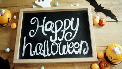 Happy-halloween-text-written-on-a-slate-4k