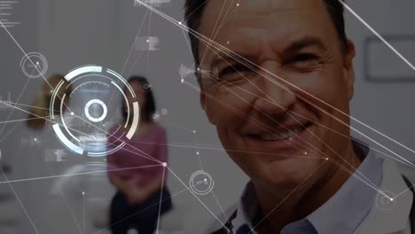 Animation-of-network-of-connections-over-caucasian-male-doctor-smiling