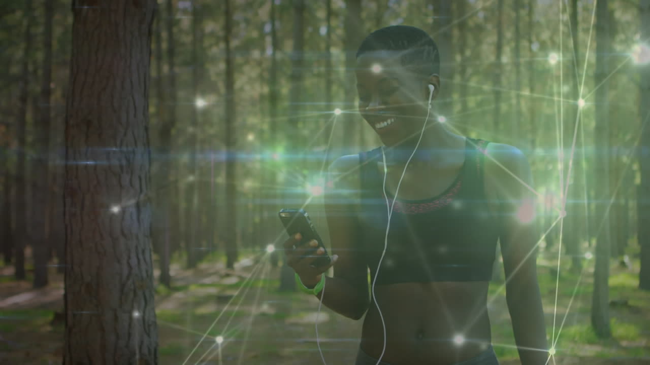 Animation of network of connections over woman exercising in forest