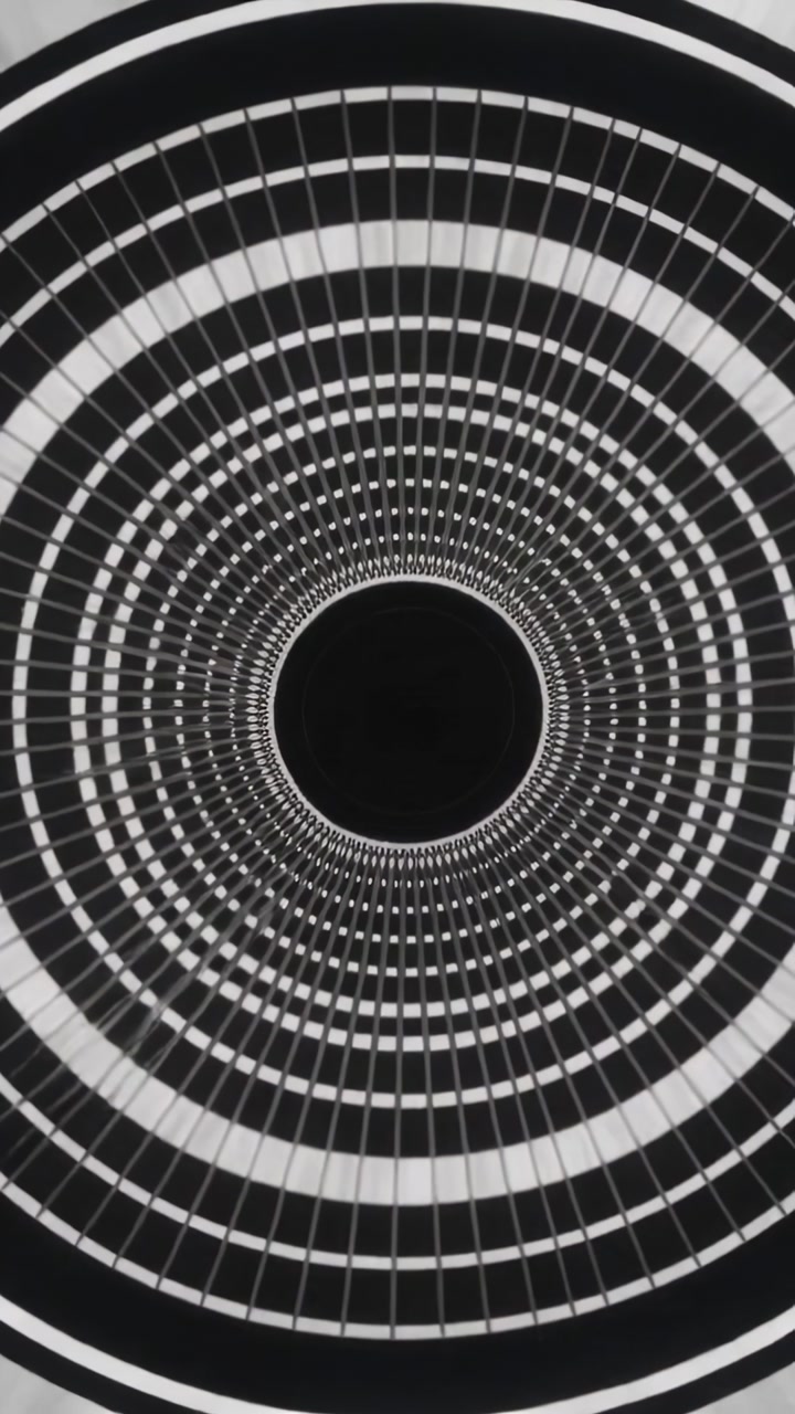 Vertical video: Starting play, rotating ring pattern with grid pulsing into void, creating trance