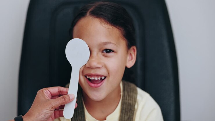 Eye exam, face and optometrist cover child vision