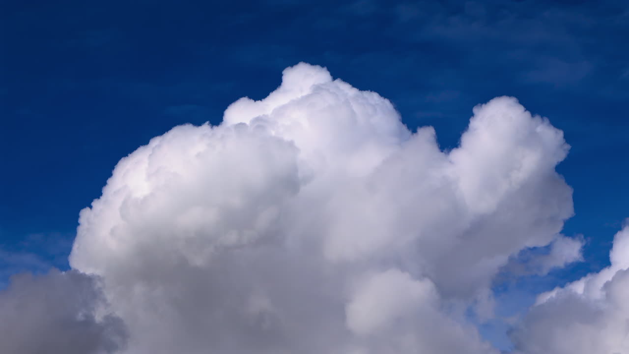 View of white clouds, fluffy moving on the blue sky