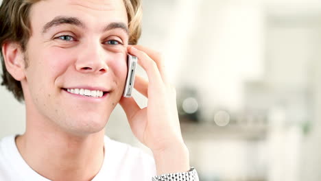 attractive-young-man-chatting-cell-phone