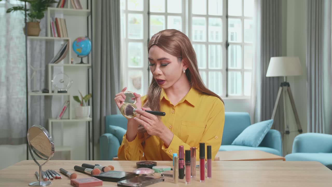 Influencer Young Transgender Woman Blogger Talks About Makeup. Blogger Talks Facial Beauty Treatments. Vlogger Broadcasts How To Use Of Cosmetic In Home Studio