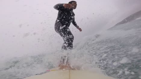 young man surfing ocean waves gopro angular view shot