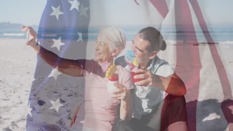on beach, older couple holding drinks with american flag animation overlay