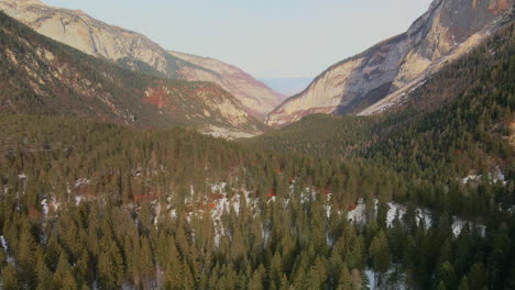 Majestic-Dolomites-Mountains-And-Fir-Trees-In-Forest-Ground-Covered-With-Fresh-Snow-In-Trentino,-Italy