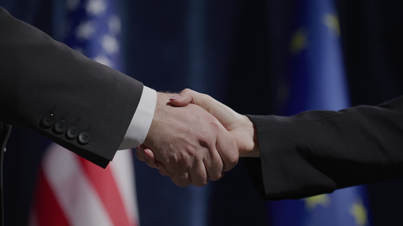 Handshake between Male and Female Politicians at Press Conference
