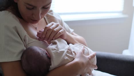tender moment of loving mother breastfeeding baby in cozy comforting setting a warm and intimate scene of a mother lovingly breastfeeding her baby in a soft comfortable and peaceful environment