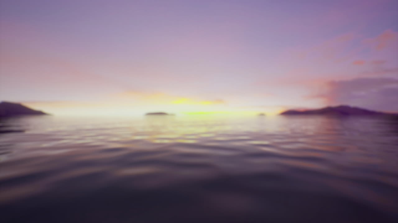 Tranquil sunset over calm waters with distant islands on the horizon