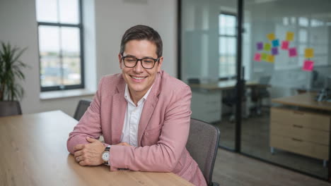 portrait of a smiling businessman in a modern office
