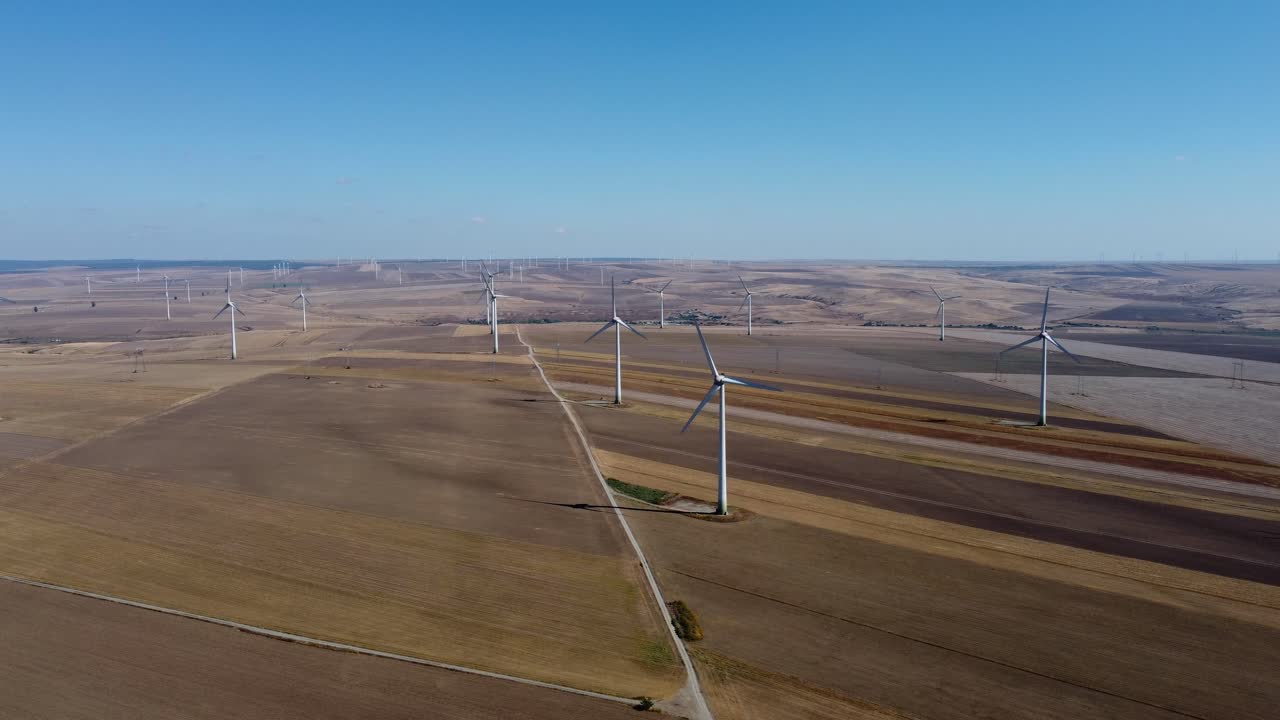 Wind farm on massive stretch of open land, drone view