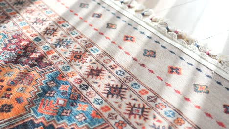 closeup of a colorful rug with intricate geometric patterns