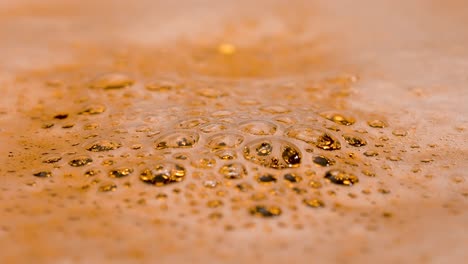 top View of full Glass of Fresh Beer with Bubbles and Foam top View of full Glass of Fresh Natural Beer with Bubbles and Foam Freshly Spilled Golden Alcoholic Drink in Glass Foam and Bubbles Close up Beautiful Beer Textured Background for Advertising Slow Motion