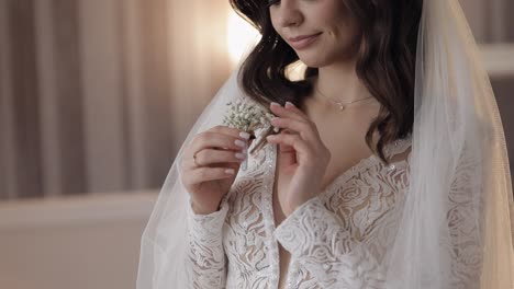 beautiful bride holding flowers and smiling