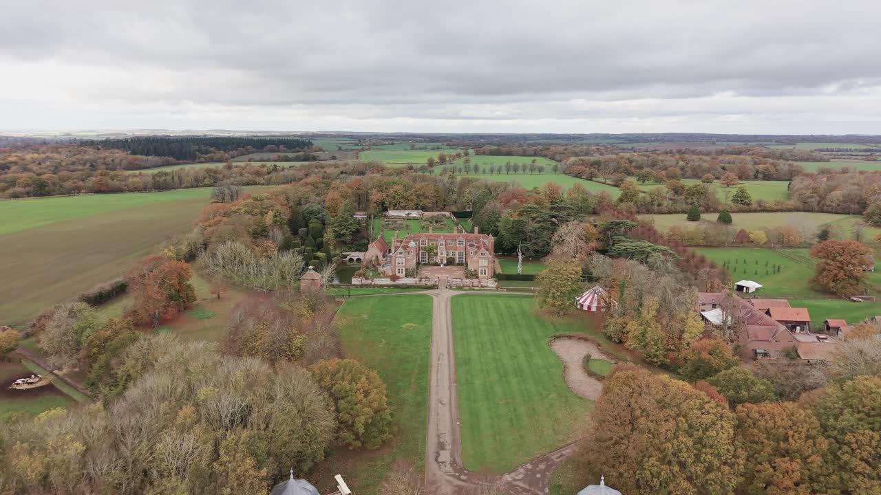 Aerial view towards Kentwell hall Tudor stately home estate garden and out buildings in Suffolk