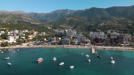 Drone-Flies-Above-Himare,-Albania-on-Beautiful-Summer-Day-in-Albanian-Riviera