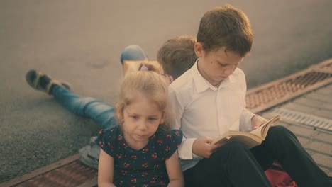 children in classic dressing prepare for hard exam outdoors