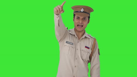 Angry-Indian-police-office-pointing-and-calling-someone-Green-screen