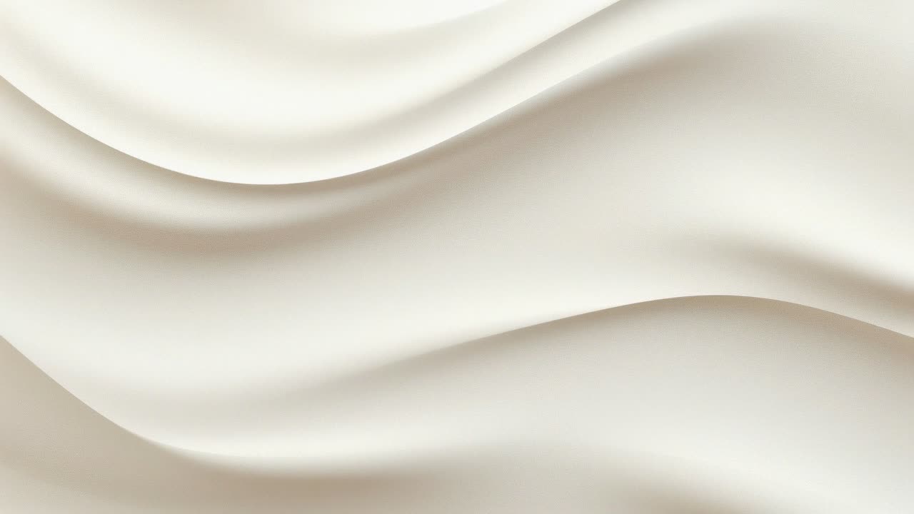 Close-up video of smooth, creamy texture with flowing, silky swirls