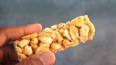 peanut brittle in hand