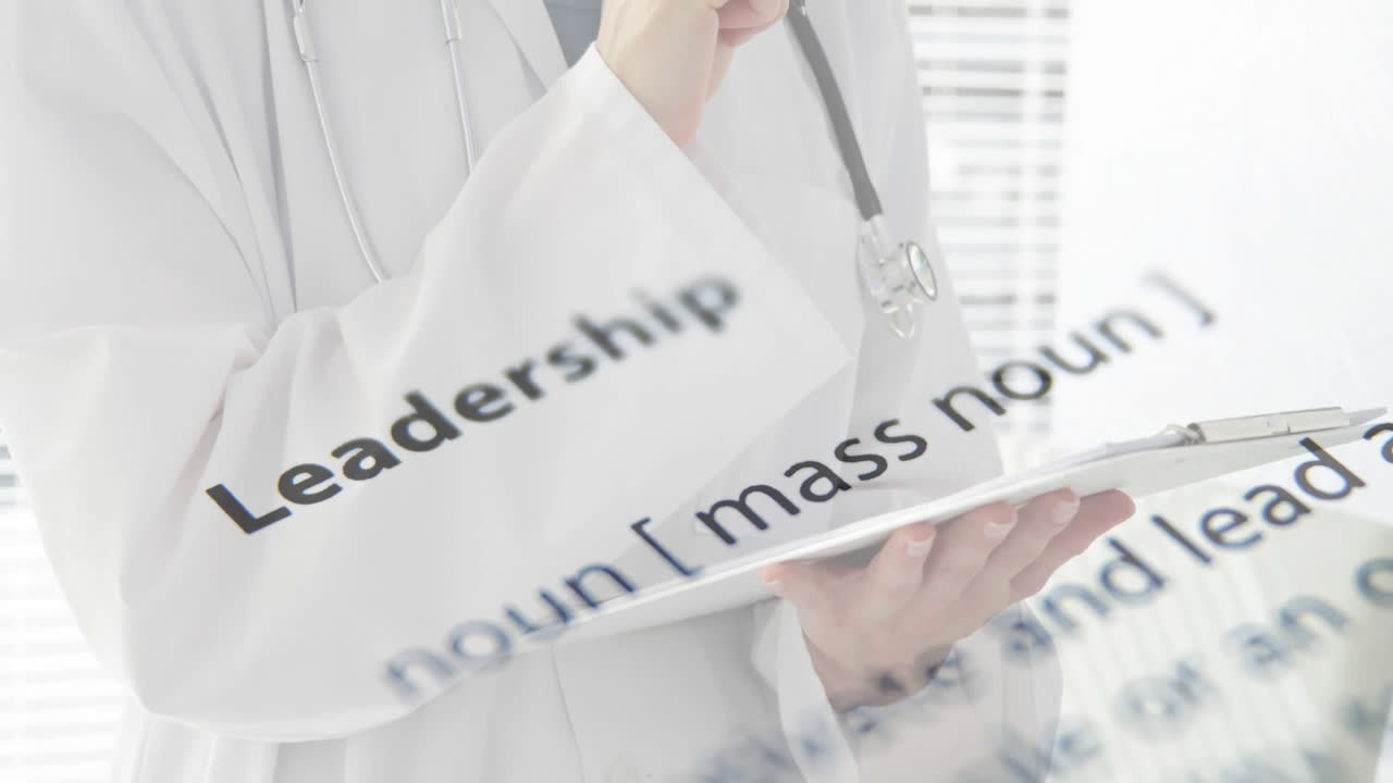 Holding clipboard, doctor with leadership definition animation overlaid in hospital