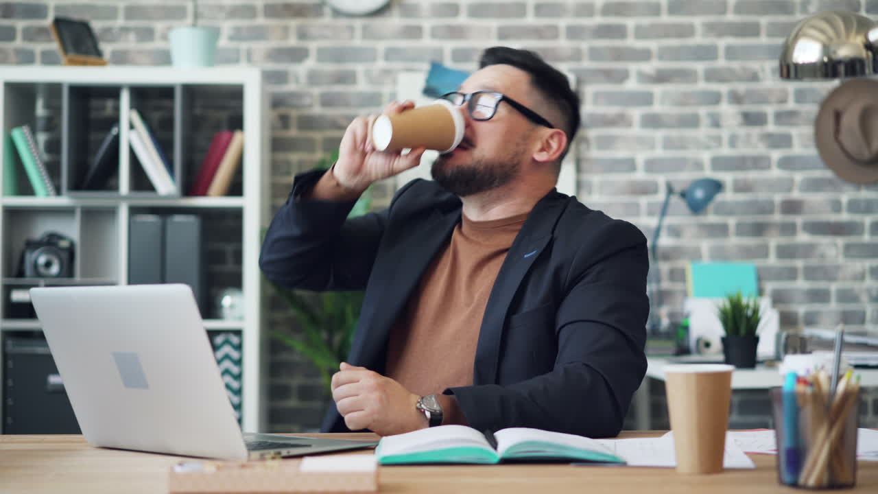 Man Surprised on Laptop in Office