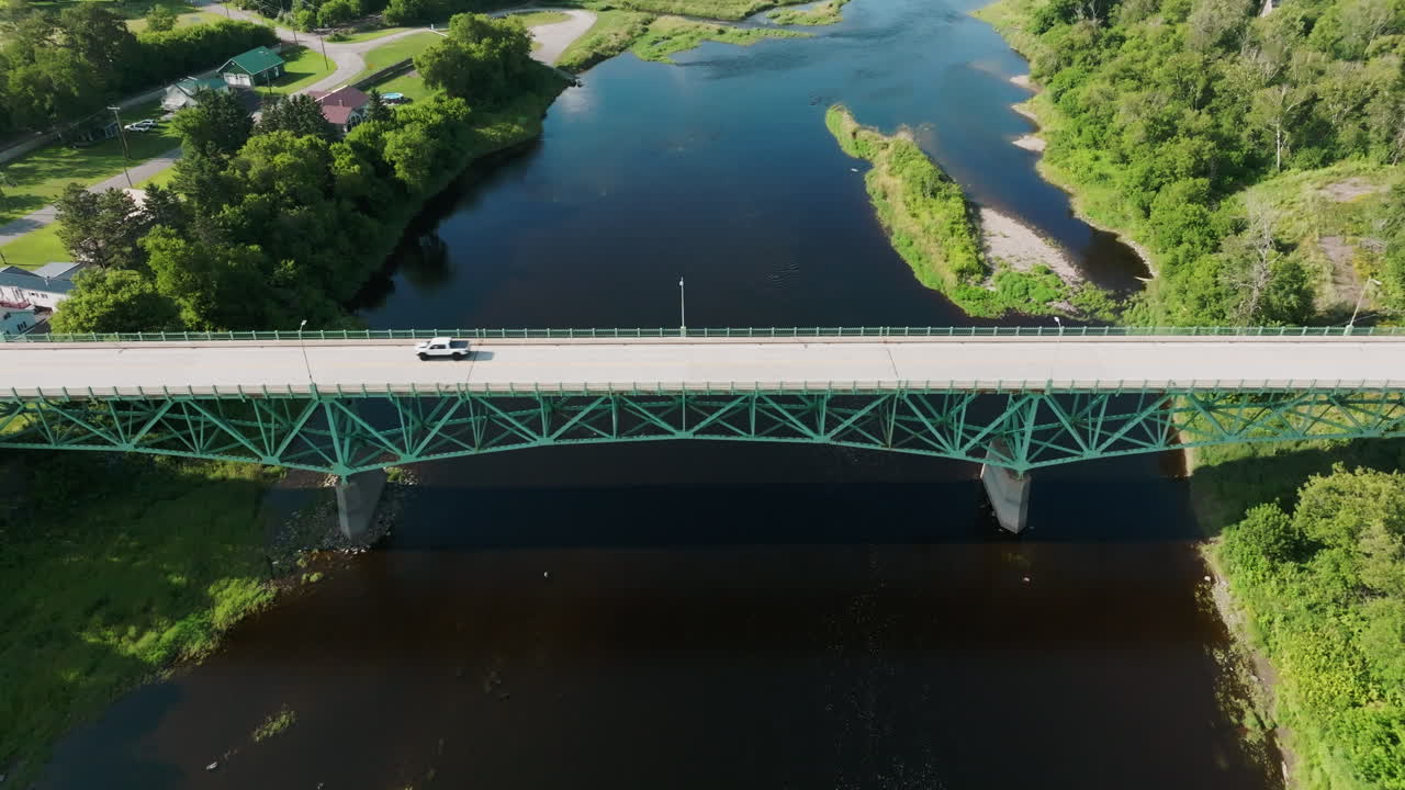 Aerial View Soars High Above Large Bridge in Maine's Peaceful Countryside